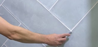 Regrouting A Kitchen Tile Countertop With Green Tiles Tile