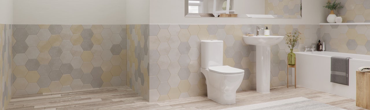 A contemporary Ideal Standard bathroom suite featuring a toilet, sink and bath
