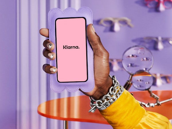 Image of a phone with the Klarna logo on it