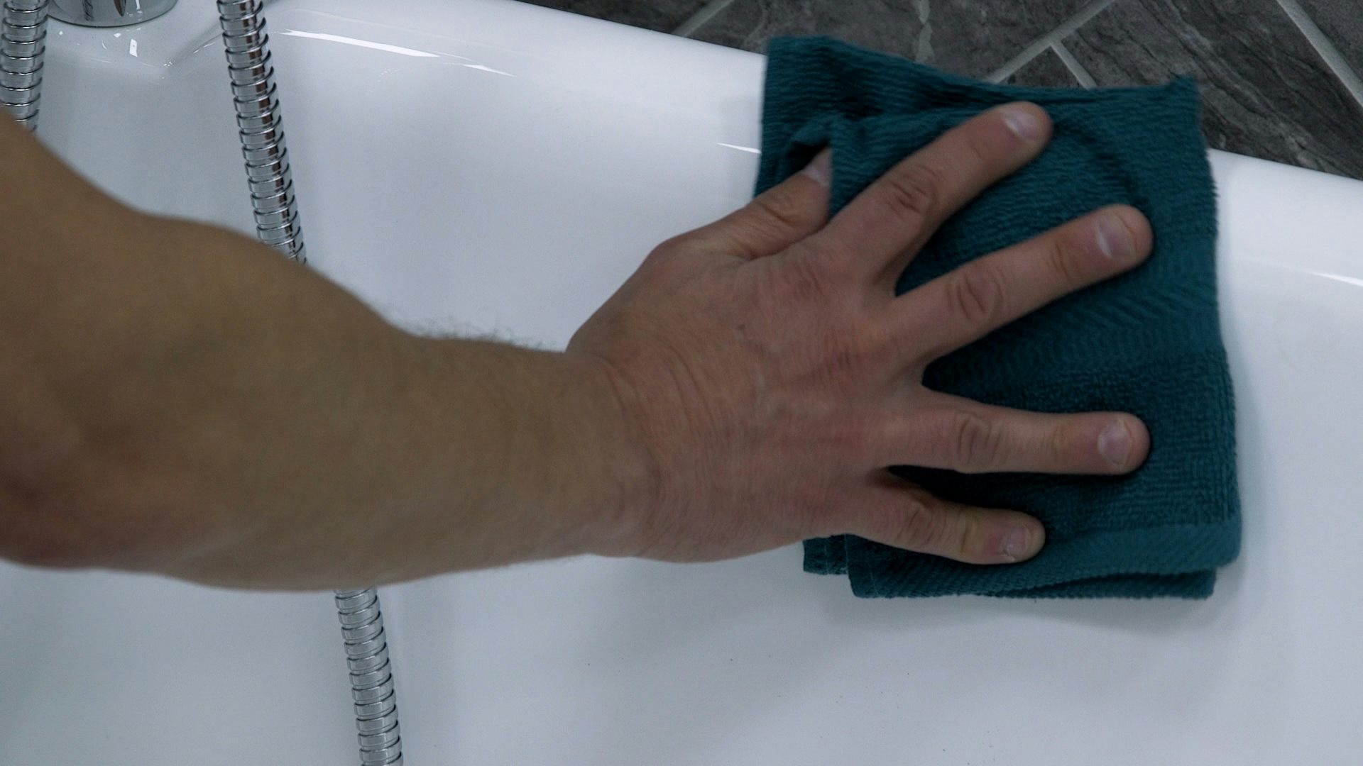 Wiping away with a soft, non-abrasive cloth