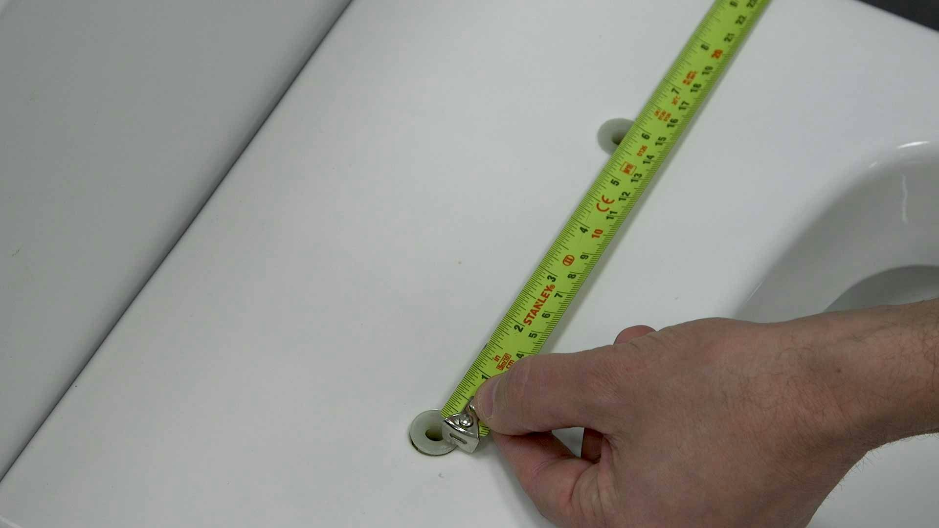 Measuring fixing holes of toilet