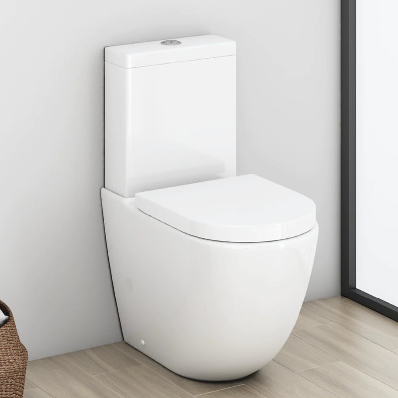 A modern close coupled toilet complete with dual flush and push button activation