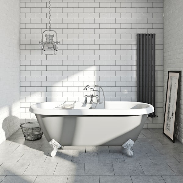 Grey painted roll top bath with metro tiles and industrial interior