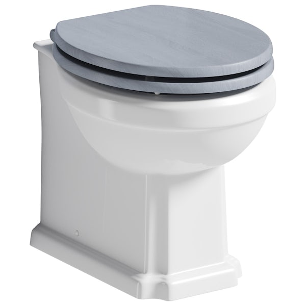 The Bath Co. Traditional back to wall toilet with powder blue soft close seat, concealed cistern and push plate